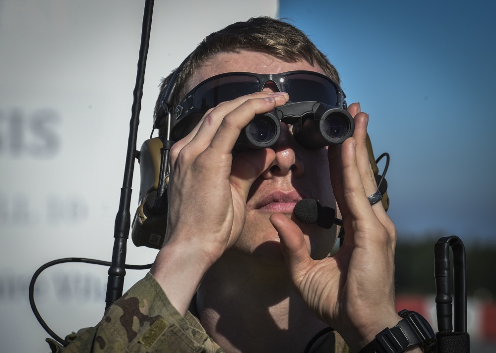 combat controller with the 321st Special Tactics Squadron looks through binocula.jpg